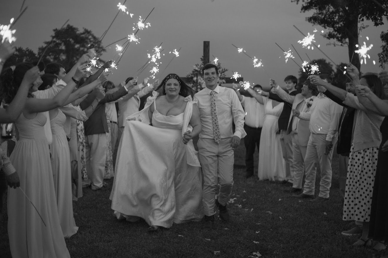 Classic outdoor bride with sparkler exit — timeless makeup